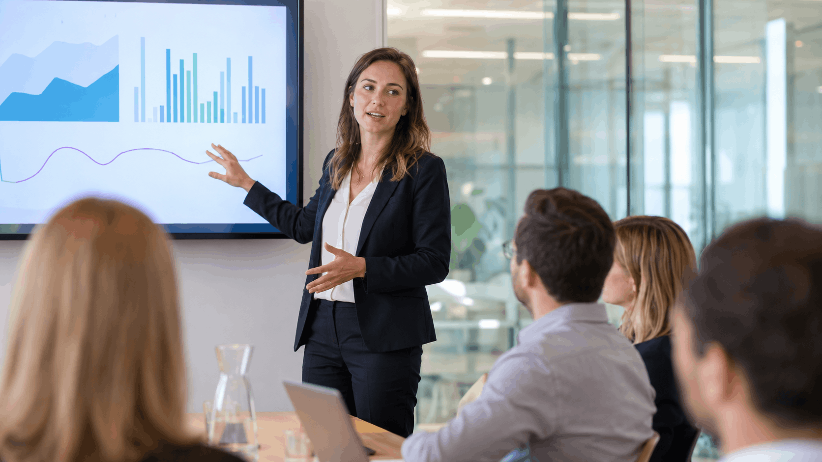 A consultant presenting analysis to colleagues in a boardroom